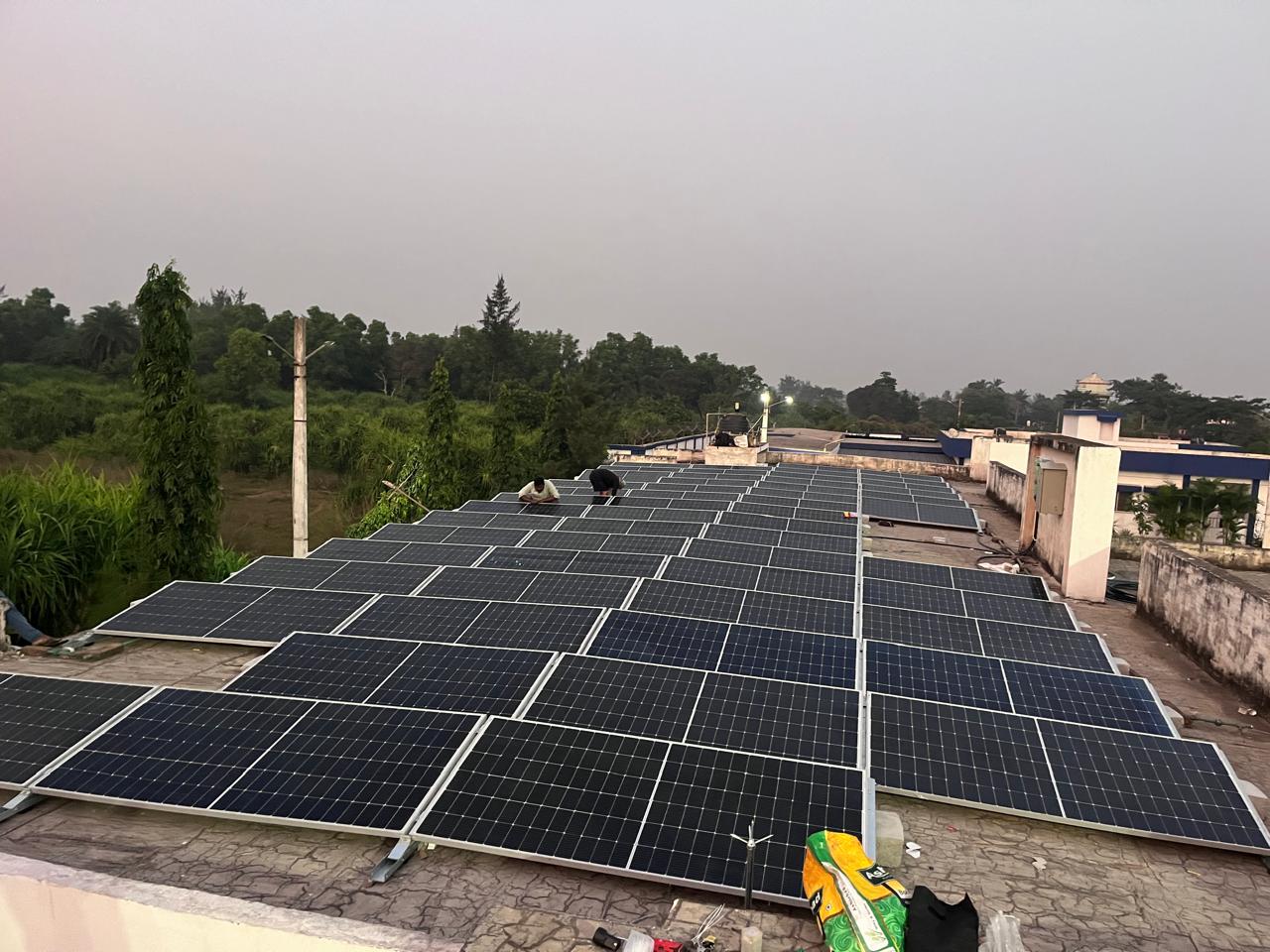 Solar technicians installing rooftop panels